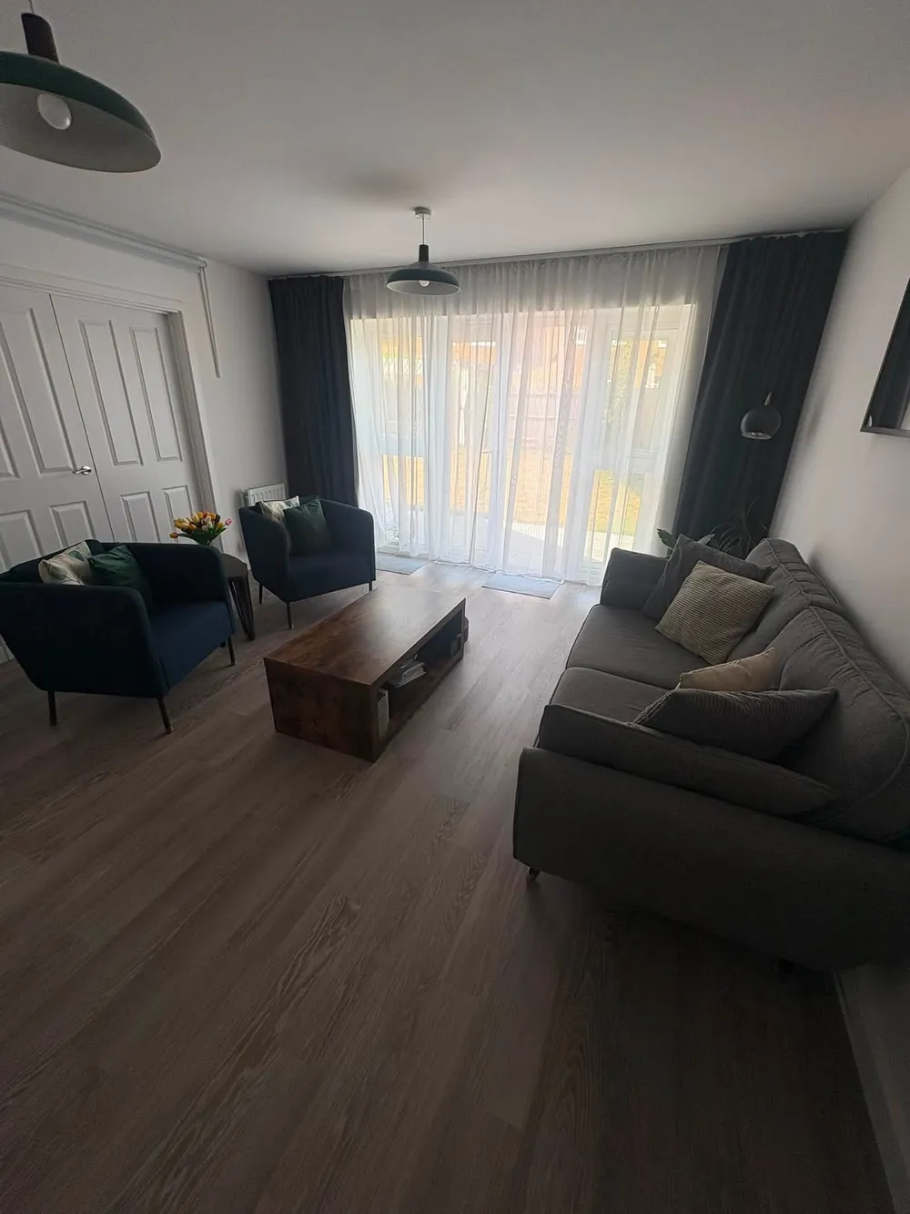 Freshly cleaned living room with vacuumed wooden floor
