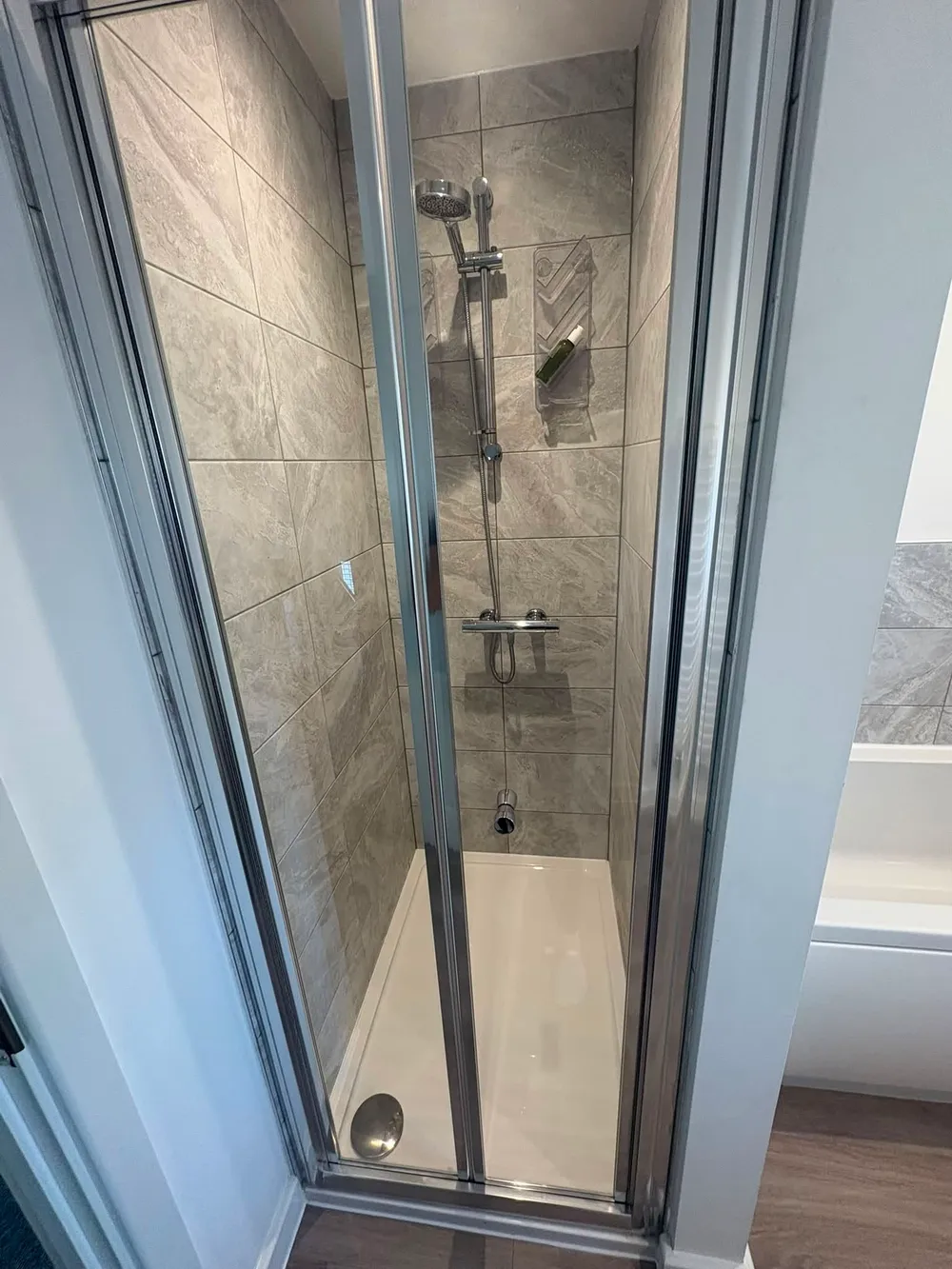 Shower enclosure cleaned, with clear glass and spotless tray